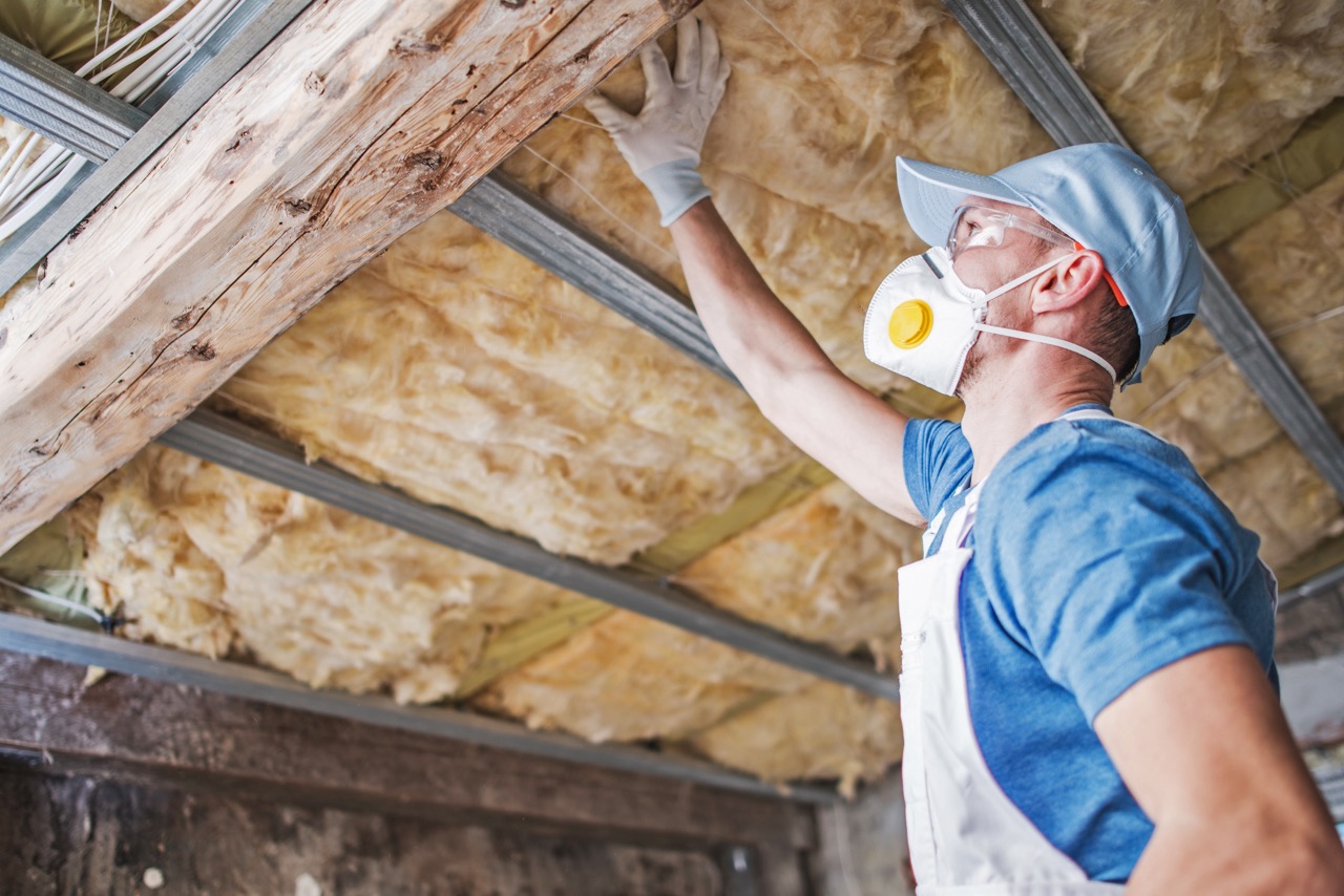 worker installing insulation